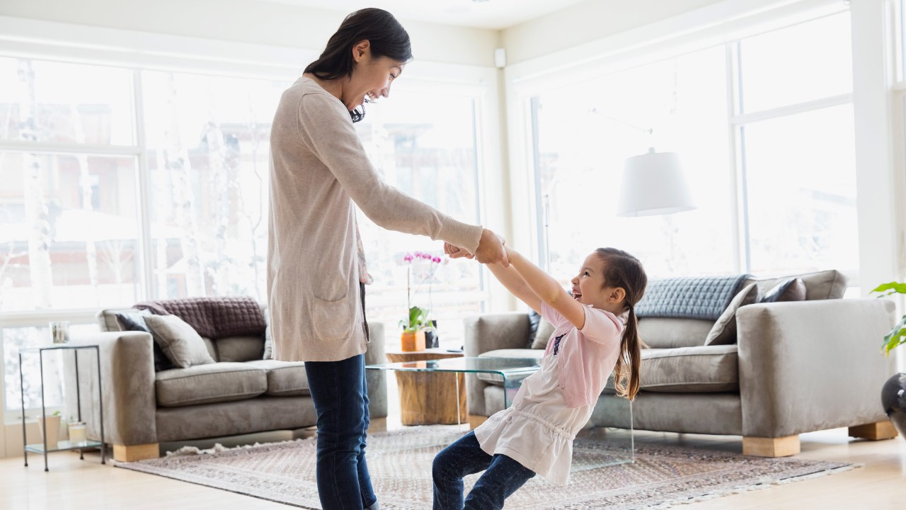 A mother is playing with her daughter; image used for HSBC Singapore Home Insurance.