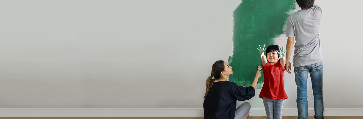 A family is painting the wall; image used for HSBC Singapore Give your home a new lease of life.