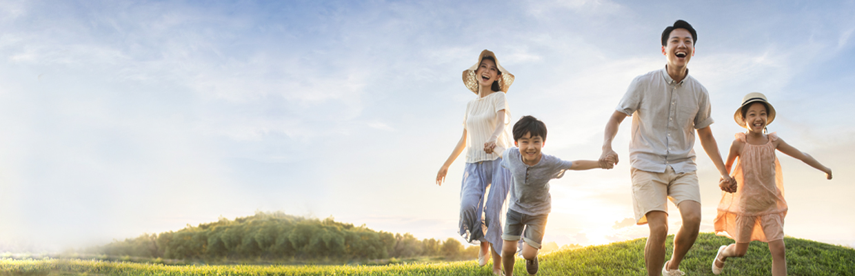 A family running on meadow; image used for HSBC Personal Banking.