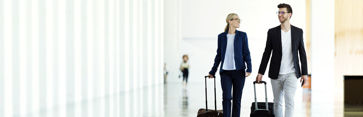 Business partner walking at the airport; image used for HSBC International investors.